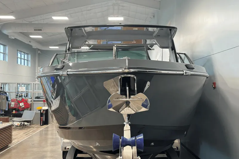 Slide: The Image of 2023 Aviara AV32 boat displayed indoors, showcasing sleek design and modern features. - 2