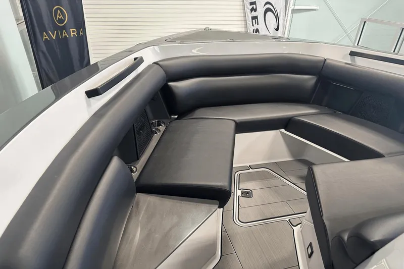 Slide: The Image of 2023 Aviara AV32 boat interior with sleek black seating and modern design. - 26