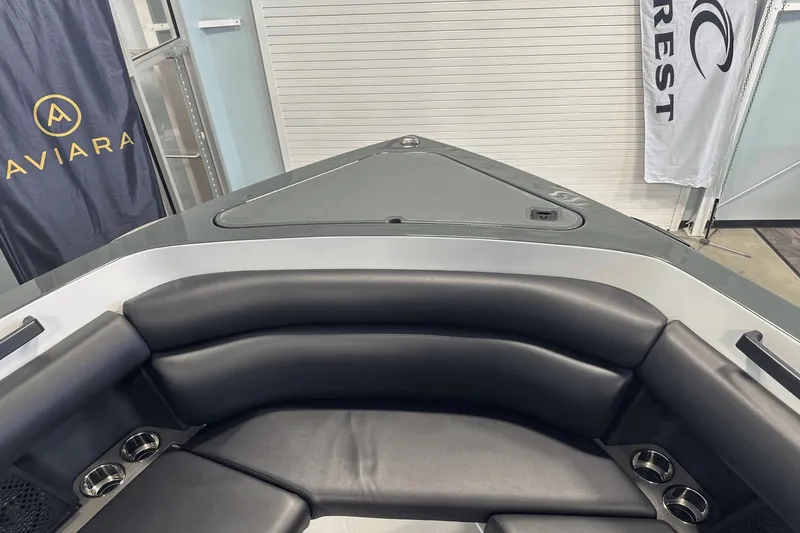 Slide: The Image of 2023 Aviara AV32 boat interior with sleek black seating and cup holders. - 28
