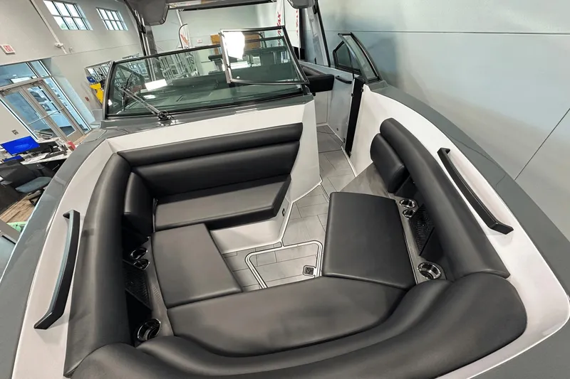 Slide: The Image of 2023 Aviara AV32 boat interior with sleek black seating and modern design. - 29