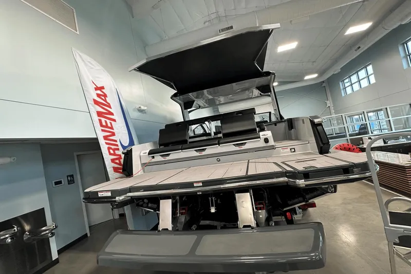 Slide: The Image of 2023 Aviara AV32 boat displayed indoors at MarineMax showroom. - 3
