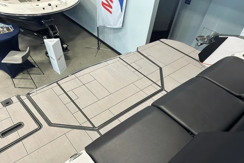 Slide: The Image of 2023 Aviara AV32 boat deck with sleek seating and modern design at a showroom. - 5