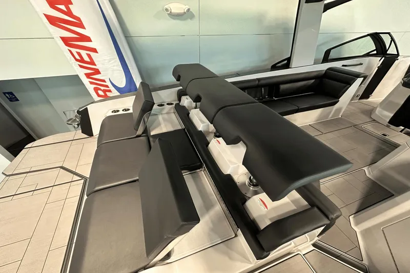 Slide: The Image of 2023 Aviara AV32 boat interior with sleek black seating and modern design elements. - 7