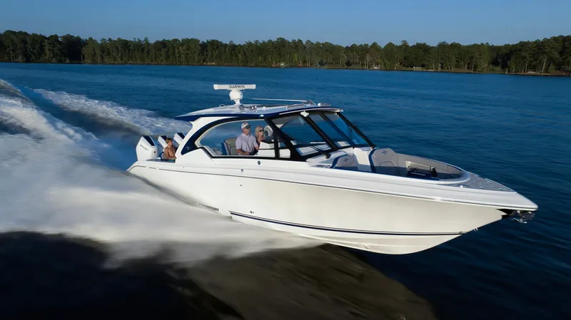 Slide: The Image of 2025 Fountain 39 DX speedboat cruising on a lake. - 3