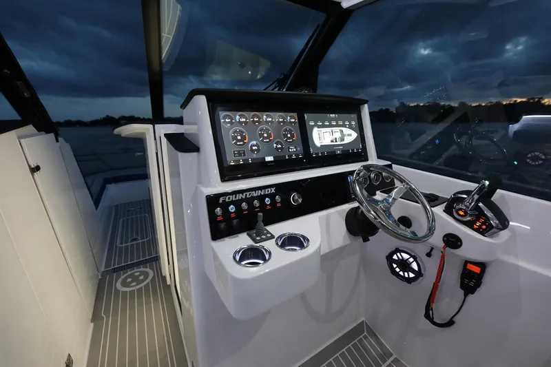 Slide: The Image of 2025 Fountain 39 DX boat cockpit with advanced navigation system and controls. - 8