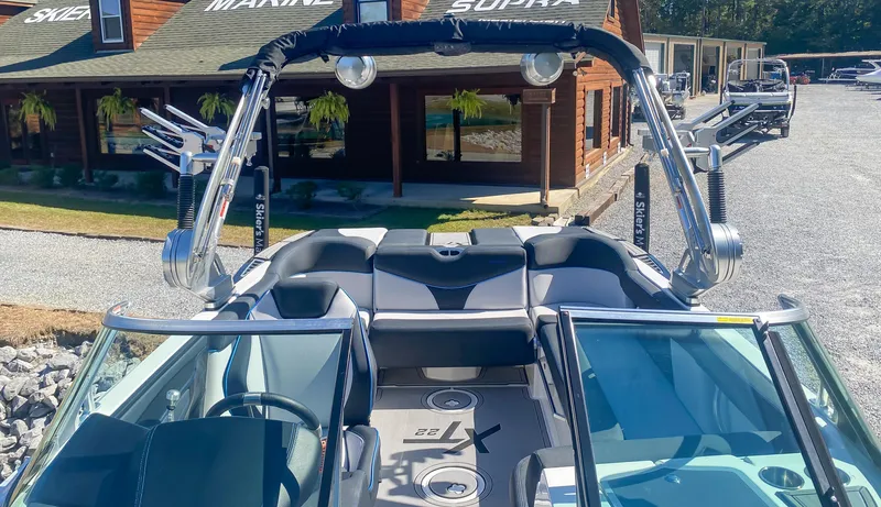 Slide: The Image of 2021 MasterCraft XT22 boat interior with sleek seating and advanced features. - 14