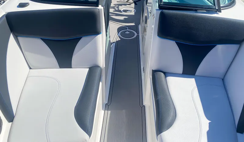 Slide: The Image of 2021 MasterCraft XT22 boat interior with stylish black and white seating. - 15