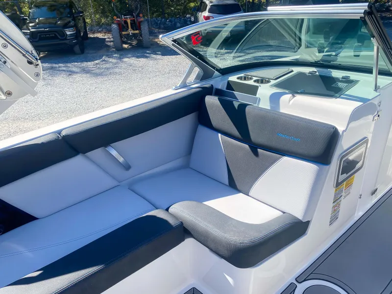 Slide: The Image of 2021 MasterCraft XT22 boat interior with sleek seating and modern design. - 19