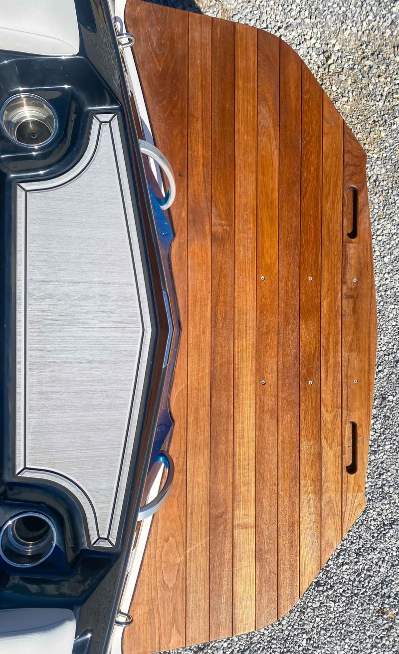 Slide: The Image of 2021 MasterCraft XT22 boat with wooden swim platform. - 22