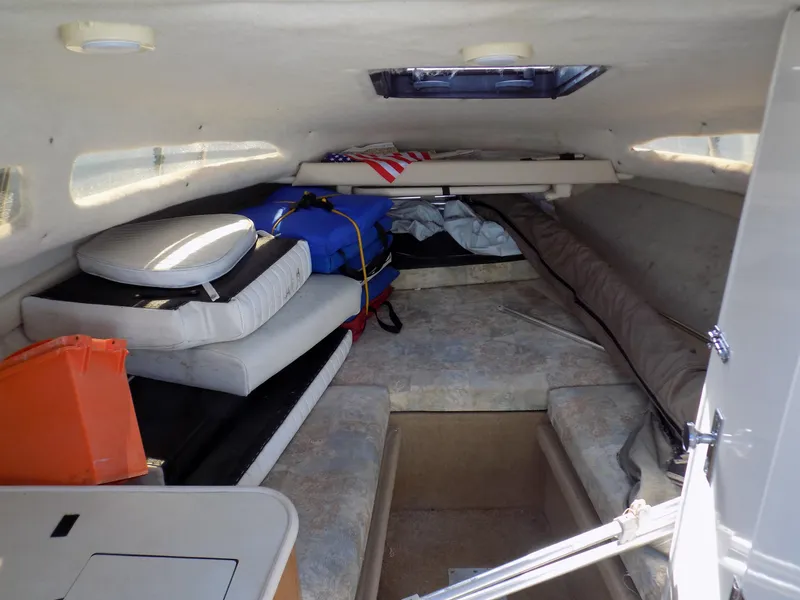 Slide: The Image of 2001 Bayliner 2252 Ciera Classic cabin interior with cushions and storage items. - 4