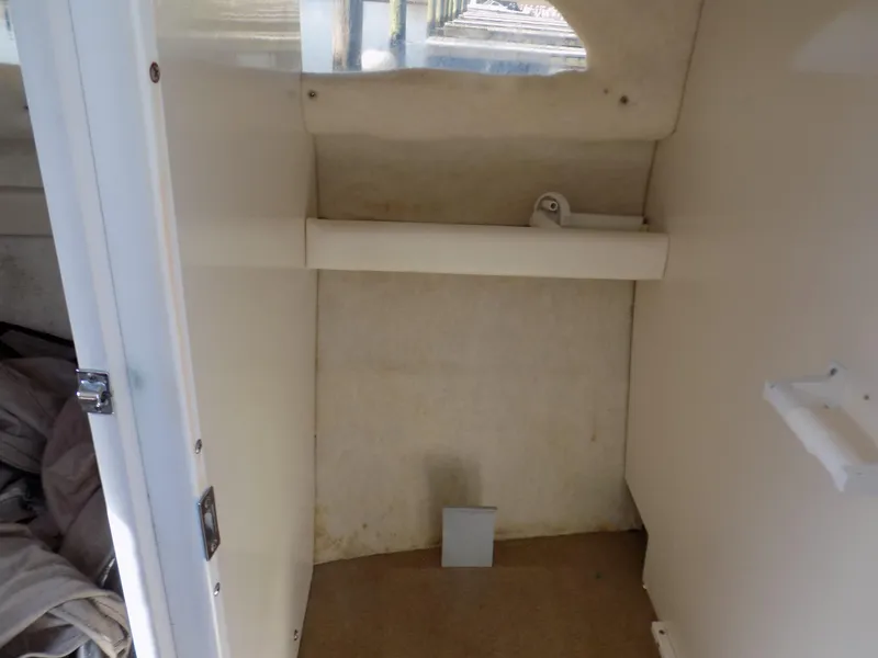 Slide: The Image of 2001 Bayliner 2252 Ciera Classic cabin interior with storage space and window. - 6