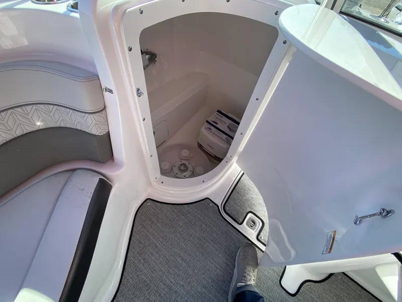 Slide: The Image of 2023 Hurricane SD2200 boat interior storage compartment with carpeted flooring. - 16