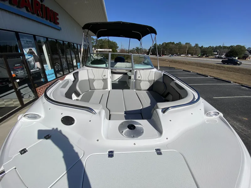 Slide: The Image of 2023 Hurricane SD2200 boat with spacious seating and canopy, displayed outdoors. - 6