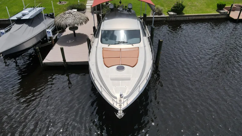 Slide: The Image of 2006 Pershing Cruiser docked in a residential marina. - 1