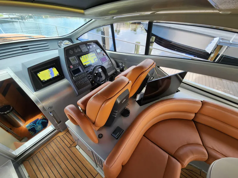 Slide: The Image of 2006 Pershing Cruiser helm with leather seats and advanced navigation system. - 12