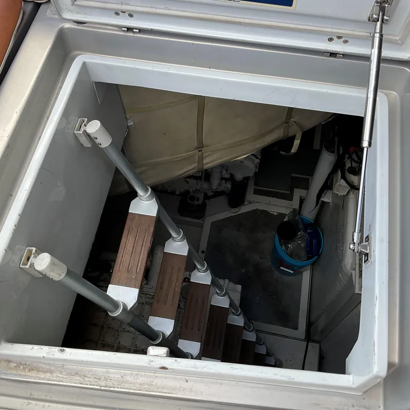 Slide: The Image of Engine room access hatch with ladder on a 2006 Pershing Cruiser. - 36