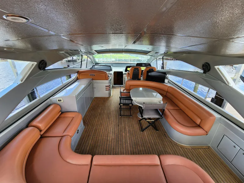 Slide: The Image of Interior of a 2006 Pershing Cruiser with luxurious leather seating and modern design. - 6