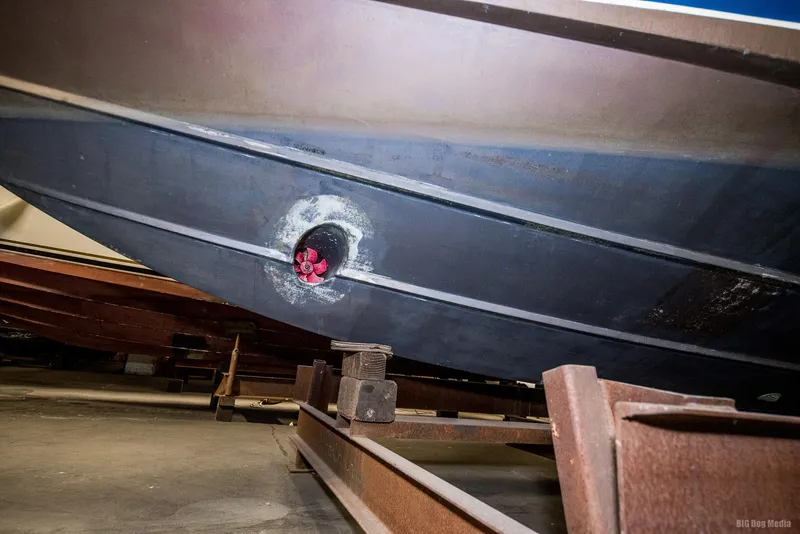 Slide: The Image of 1985 Chris-Craft 336 Mid Cabin boat hull on trailer, close-up view. - 8