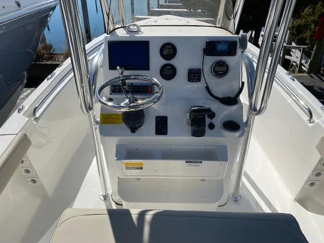 Slide: The Image of 2023 Key West 189 FS boat console with steering wheel and navigation controls. - 3