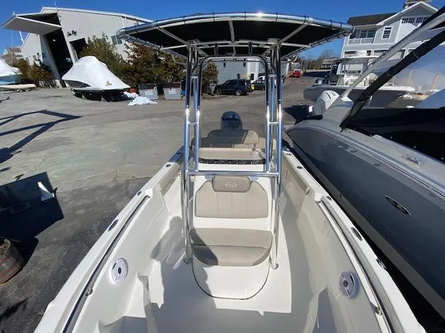 Slide: The Image of 2023 Key West 189 FS boat with T-top, docked in a marina. - 5