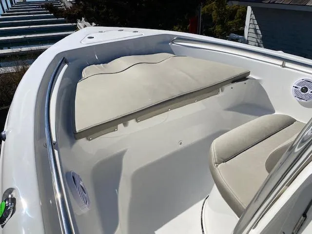 Slide: The Image of 2023 Key West 189 FS boat interior with cushioned seating and sleek design. - 6