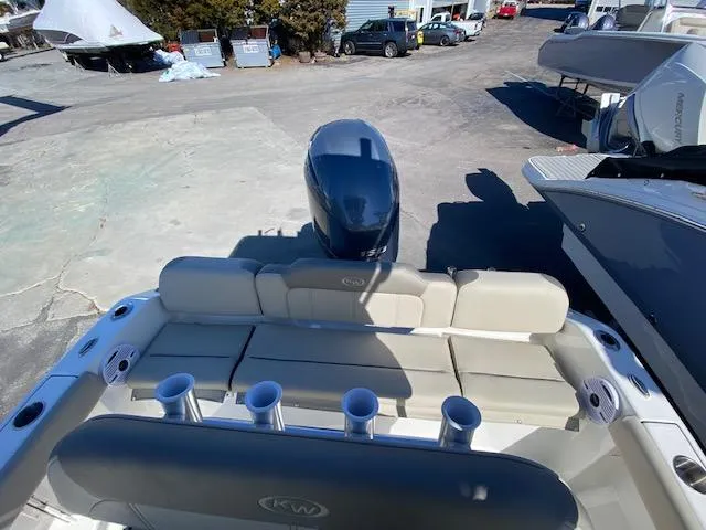 Slide: The Image of 2023 Key West 189 FS boat with seating and motor, docked outdoors. - 8