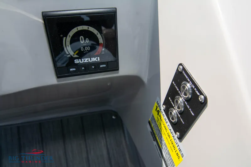 Slide: The Image of Suzuki gauge and controls on 2022 Manitou 25 OASIS RF SHP boat dashboard. - 17