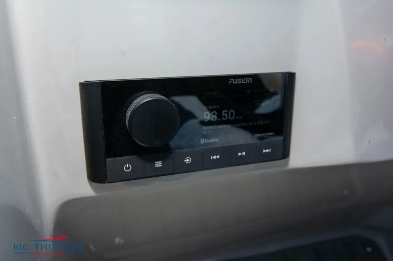 Slide: The Image of Fusion stereo system on 2022 Manitou 25 OASIS RF SHP boat dashboard. - 18