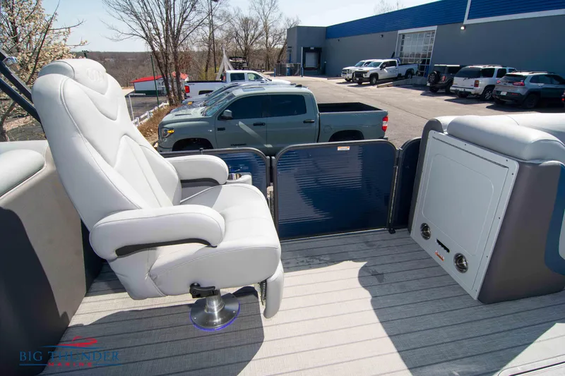 Slide: The Image of 2022 Manitou 25 OASIS RF SHP pontoon boat interior with plush seating. - 23