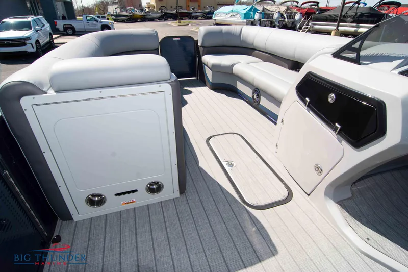 Slide: The Image of 2022 Manitou 25 OASIS RF SHP pontoon boat interior with spacious seating and modern design. - 25