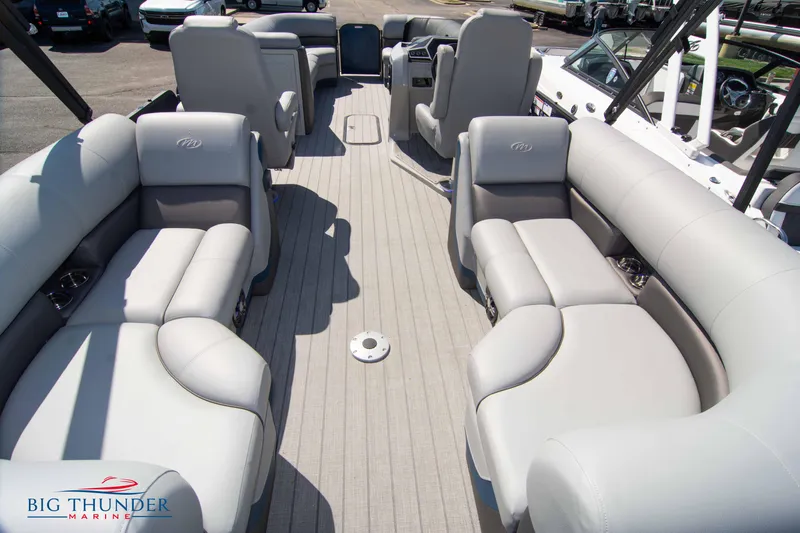 Slide: The Image of 2022 Manitou 25 OASIS RF SHP pontoon boat interior with spacious seating. - 32