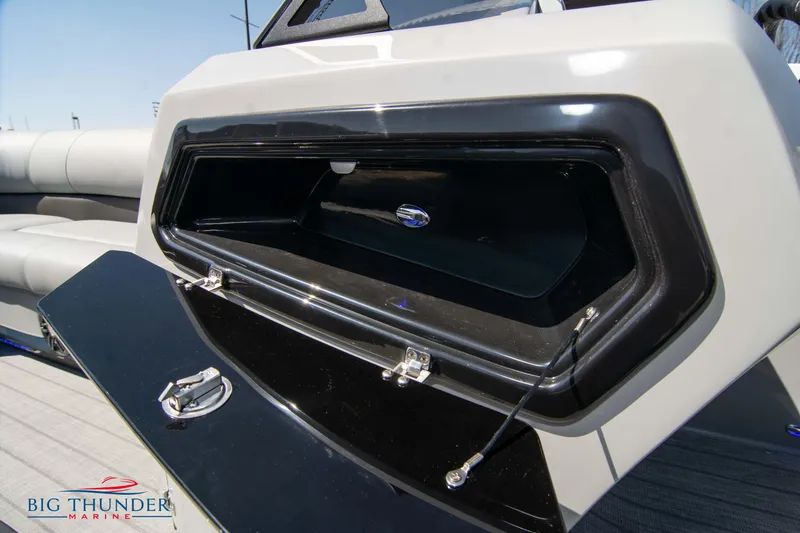Slide: The Image of 2022 Manitou 25 OASIS RF SHP storage compartment on a pontoon boat. - 37