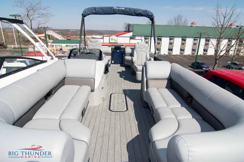 Slide: The Image of 2022 Manitou 25 OASIS RF SHP pontoon boat with spacious seating and modern design. - 5