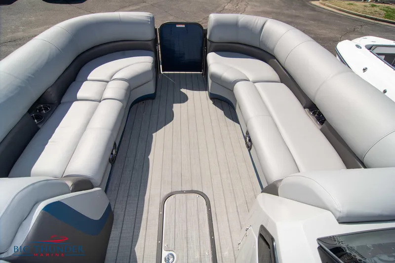 Slide: The Image of 2022 Manitou 25 OASIS RF SHP pontoon boat with spacious seating and modern design. - 8
