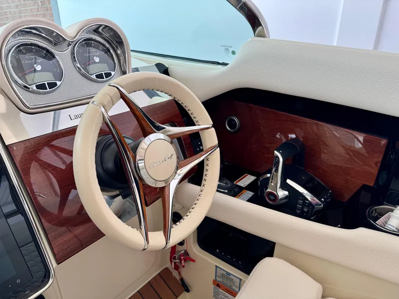 Slide: The Image of 2024 Chris-Craft Launch 35 GT dashboard with elegant steering wheel and controls. - 38