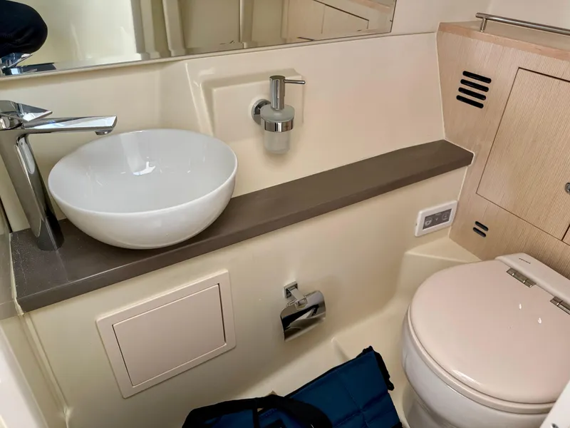 Slide: The Image of 2024 Chris-Craft Launch 35 GT bathroom with modern sink and toilet. - 40