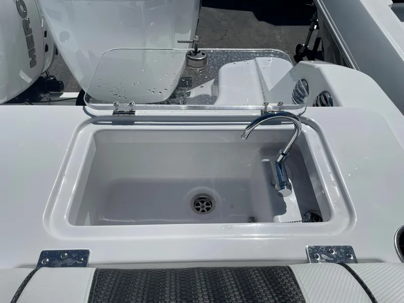 Slide: The Image of 2023 Wellcraft 352 Fisherman boat sink with faucet and drain. - 12
