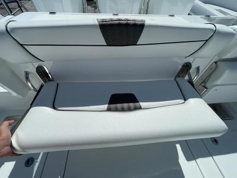 Slide: The Image of 2023 Wellcraft 352 Fisherman boat seat with foldable design and modern upholstery. - 14