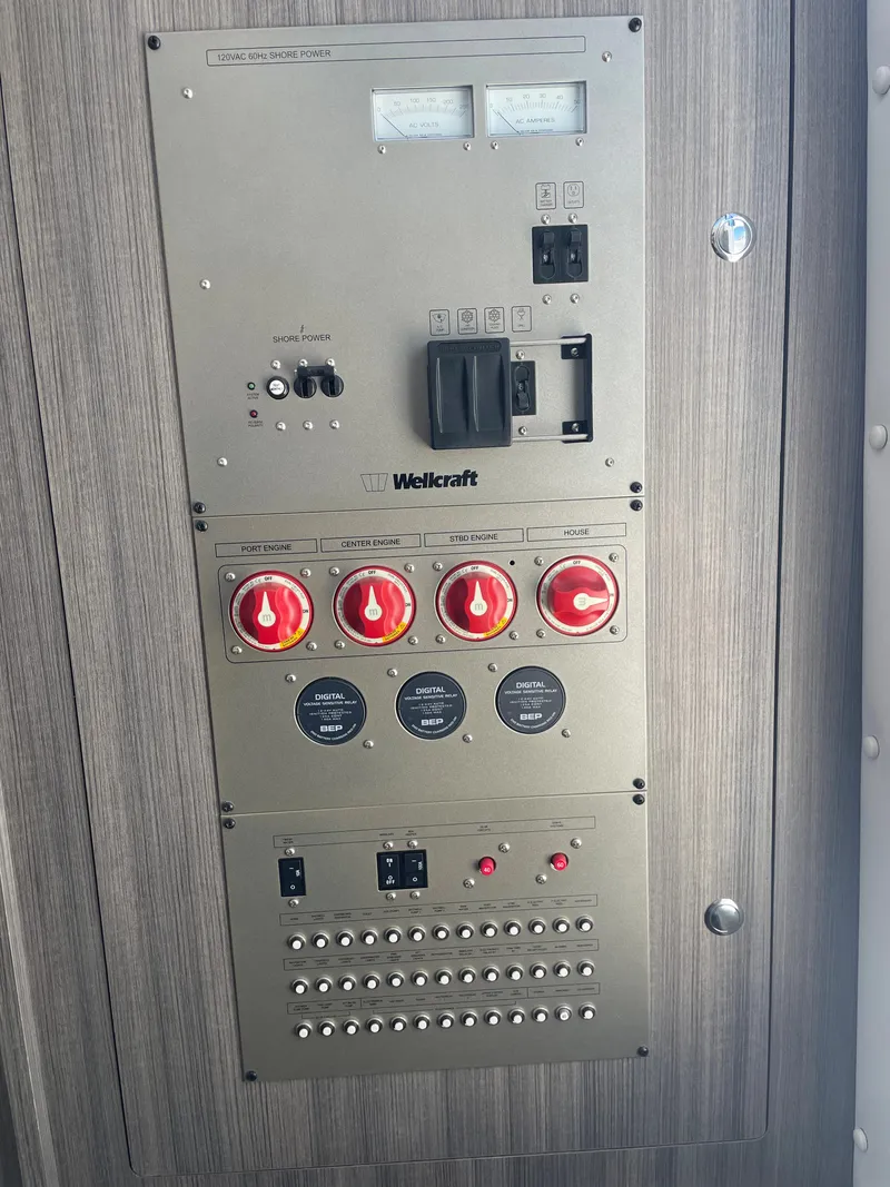 Slide: The Image of Control panel of 2023 Wellcraft 352 Fisherman boat with switches and dials. - 33