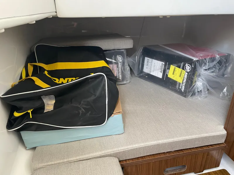 Slide: The Image of Interior storage area of 2023 Wellcraft 352 Fisherman with bags and boxes. - 34