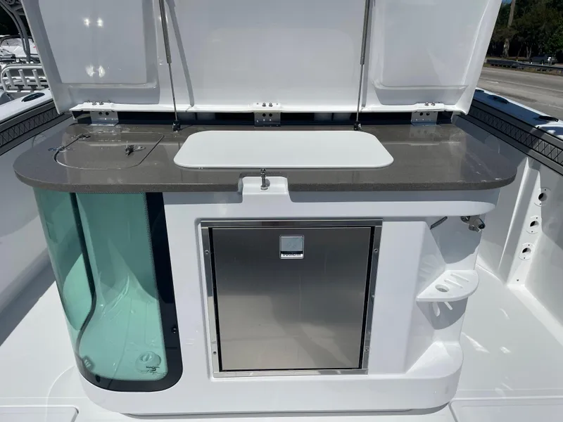 Slide: The Image of 2023 Wellcraft 352 Fisherman boat interior with storage and sink area. - 6