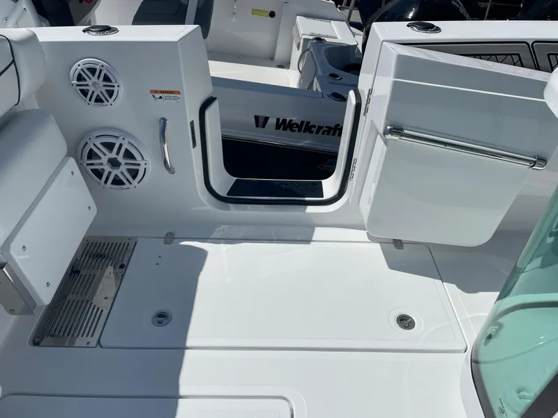 Slide: The Image of 2023 Wellcraft 352 Fisherman boat deck with speakers and open door. - 9