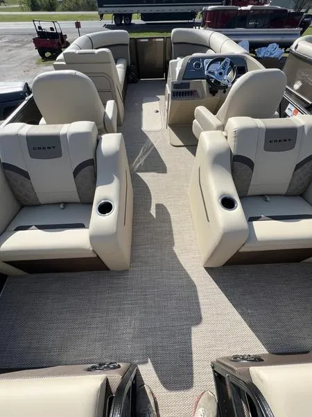 Slide: The Image of 2023 Crest Classic DLX 220 SLRC CPT DLX pontoon boat interior with plush seating. - 10