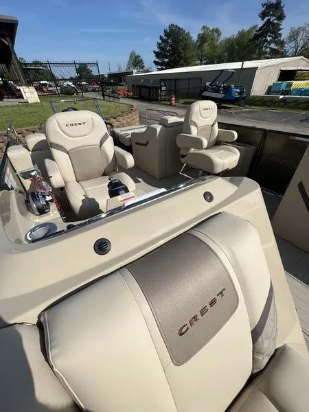 Slide: The Image of 2023 Crest Classic DLX 220 SLRC boat with luxurious seating and modern design. - 6