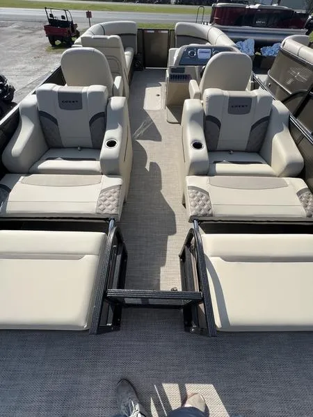 Slide: The Image of 2023 Crest Classic DLX 220 SLRC CPT DLX pontoon boat with luxurious seating. - 8