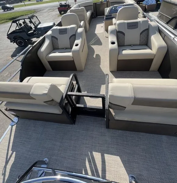 Slide: The Image of 2023 Crest Classic DLX 220 SLRC boat interior with luxurious seating and spacious layout. - 9