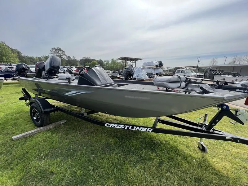Slide: The Image of 2023 Crestliner 1700 Storm boat on trailer, parked on grass. - 4