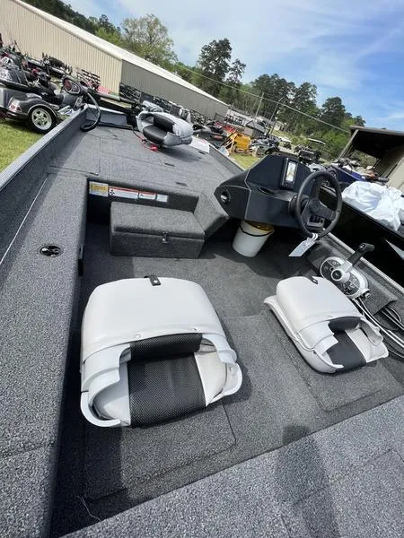 Slide: The Image of 2023 Crestliner 1700 Storm boat interior with seating and steering console. - 5