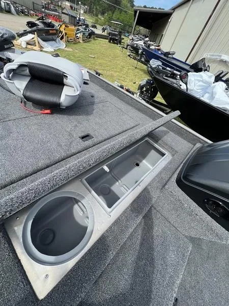 Slide: The Image of 2023 Crestliner 1700 Storm boat with open storage compartment on deck. - 7