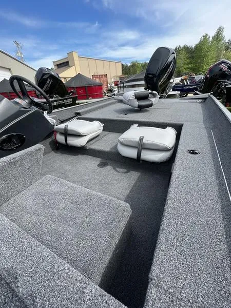 Slide: The Image of 2023 Crestliner 1700 Storm boat interior with seating and steering wheel. - 9